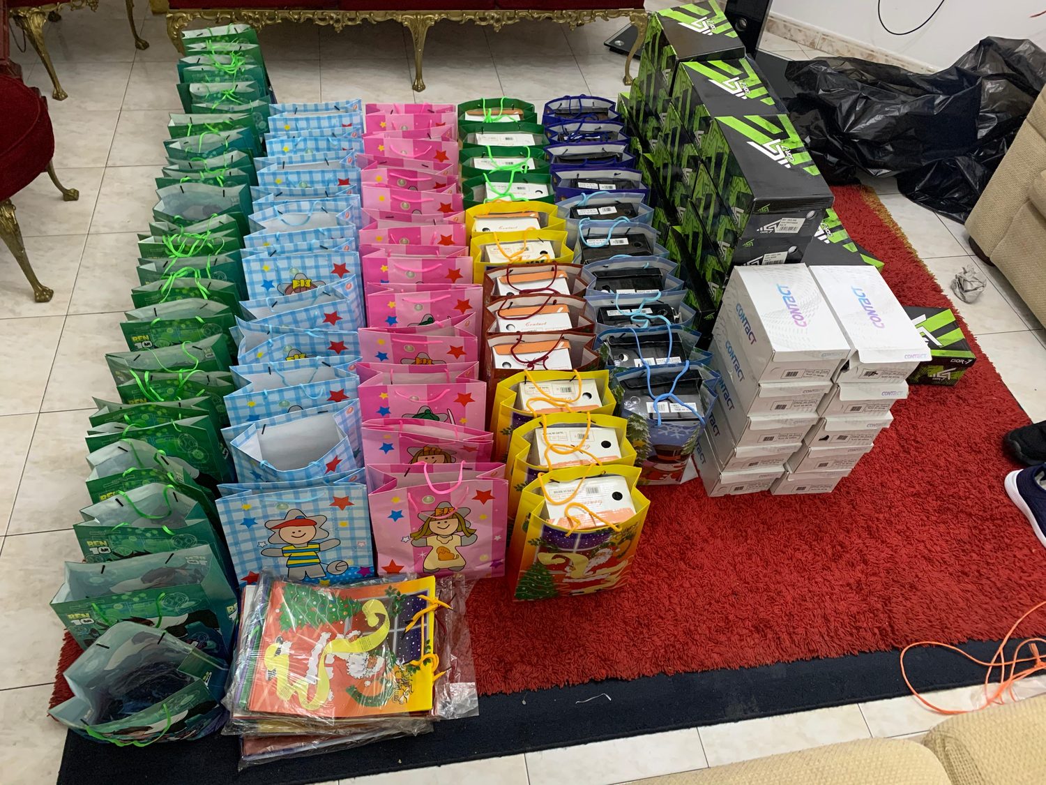 Evidence of organization - rows of colorful aid kits ready for distribution
