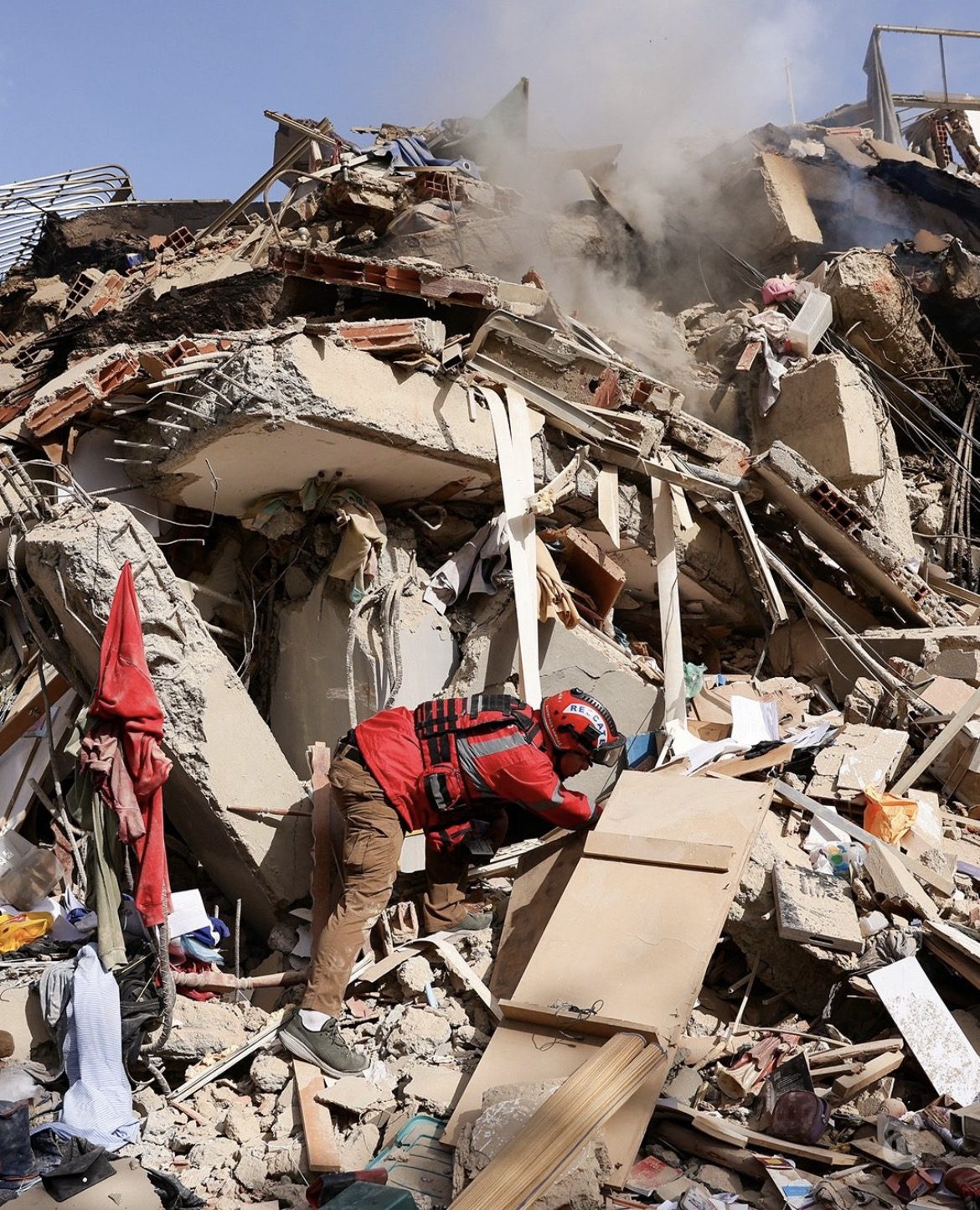 Opening/hero image - scale of destruction with active rescue in progress